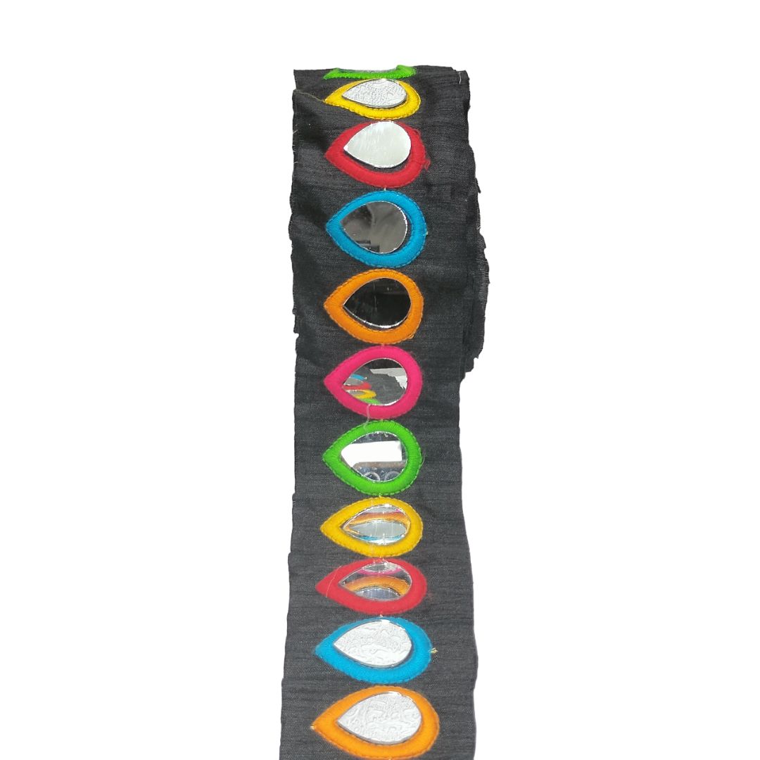 Black leggings with colorful teardrop designs on a white background